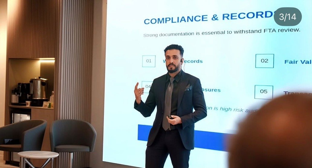 Ezat Alnajm delivering a presentation on compliance and record keeping